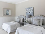two white beds in a hotel room